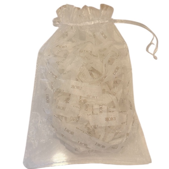 Dior Cream Pouch with Pink Embroidered Accents with Dior lipstick and Eye Liner - Picture 4 of 13